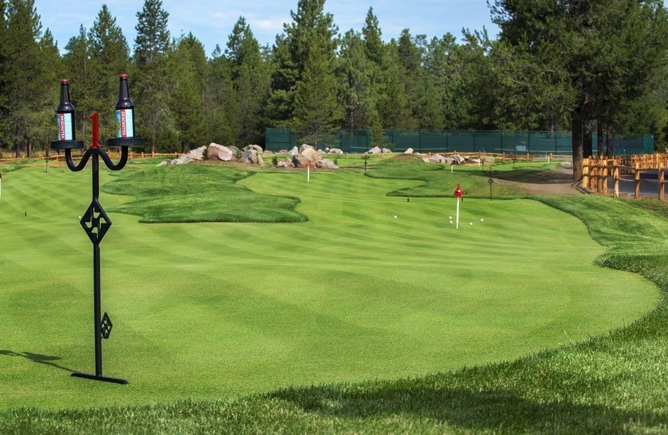 Pristine 18-hole golf course surrounded by towering pines and natural landscapes, perfect for golf enthusiasts seeking a challenging mountain retreat.