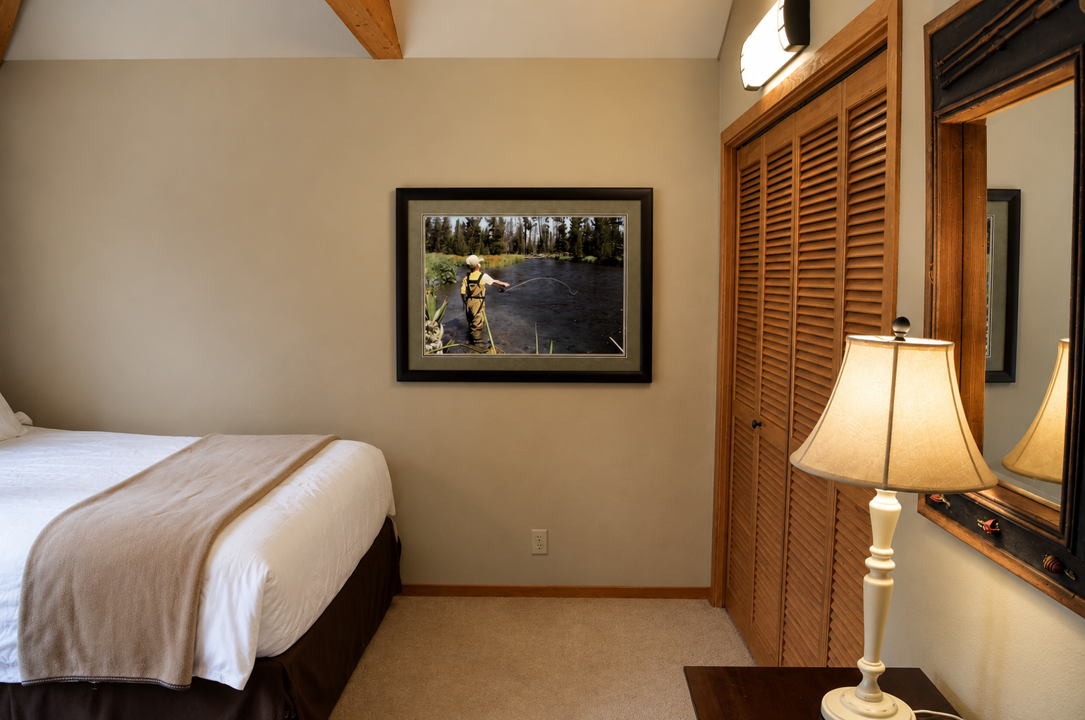 Your cozy bedroom awaits with a plush king bed, warm wood beams, and rustic charm—perfect for unwinding after a day of adventure.