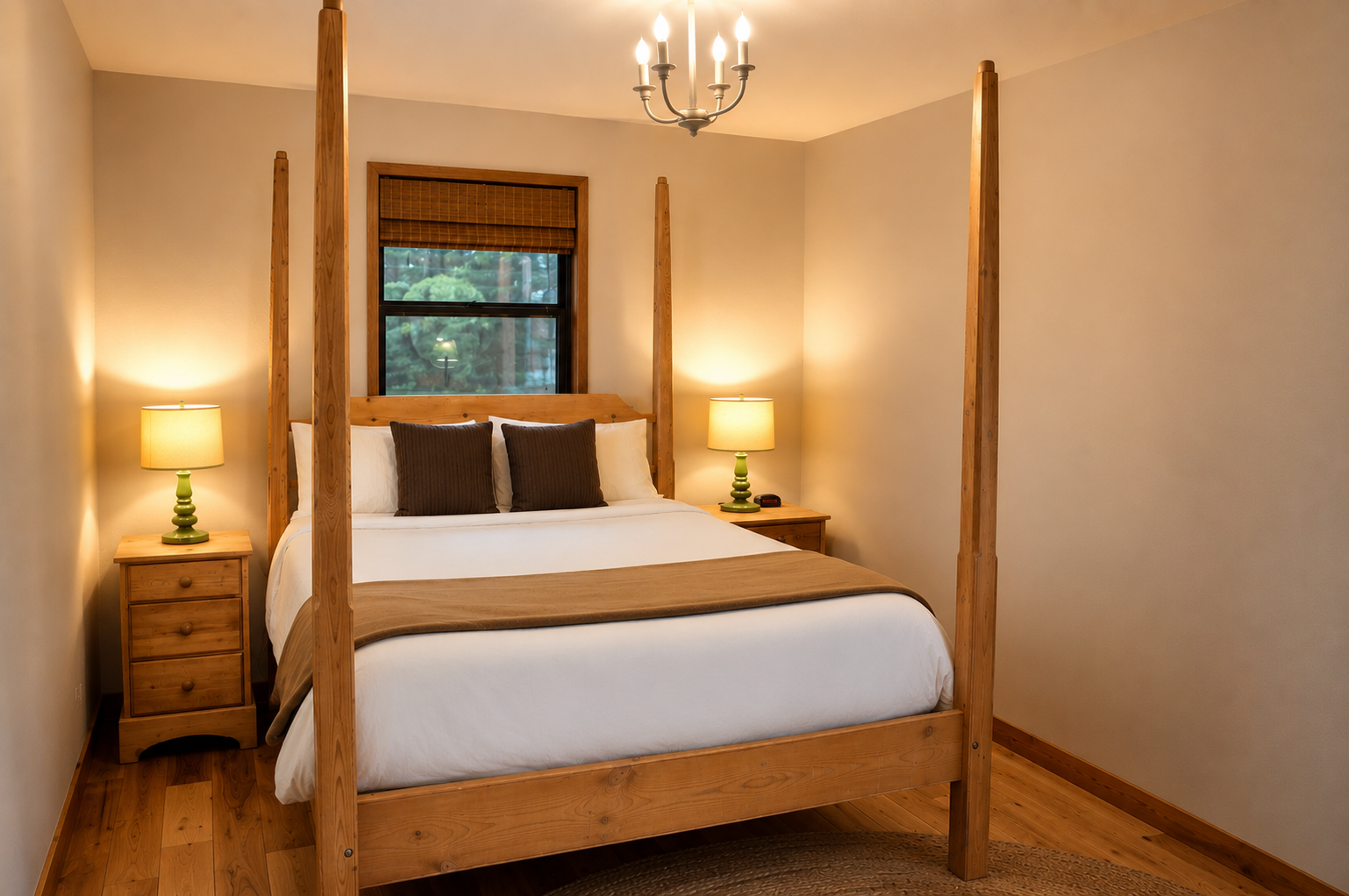 Sink into crisp white linens on your four-poster bed, framed by warm wood tones and soft lighting that creates a serene retreat after your day's adventures.