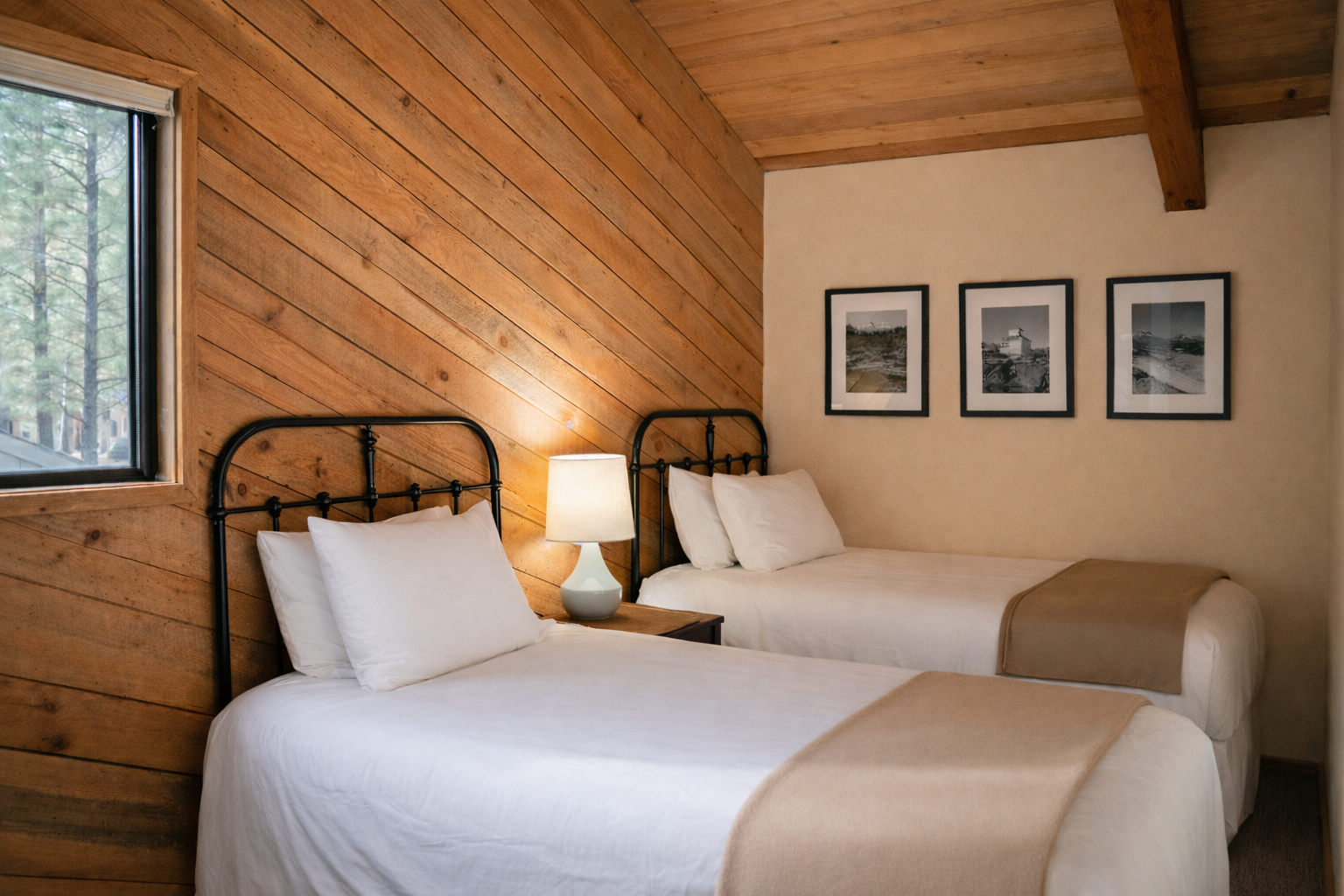 Sleep peacefully in this cozy twin bedroom where rustic wood meets modern comfort, perfectly positioned with forest views.