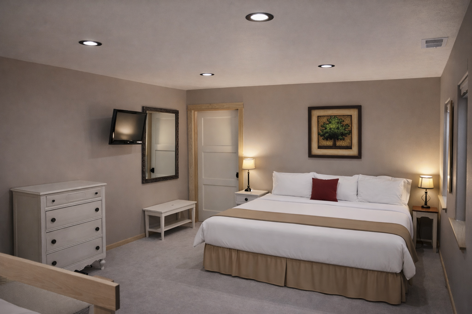 Sink into crisp white linens and unwind in your elegantly appointed bedroom, complete with modern amenities and thoughtful touches for ultimate comfort.