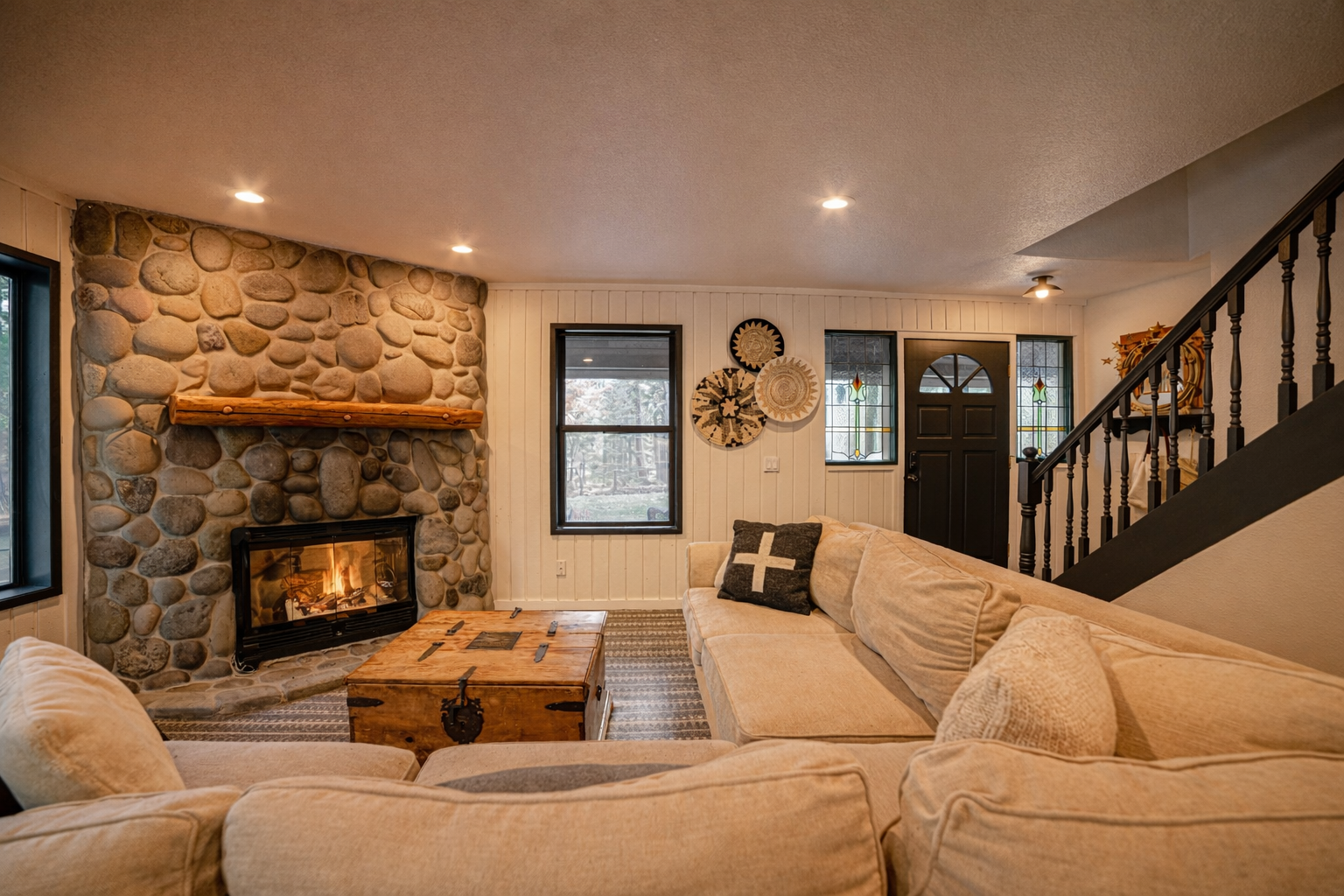 Cozy up by your stone fireplace with plush seating and rustic charm that makes every evening feel like home.