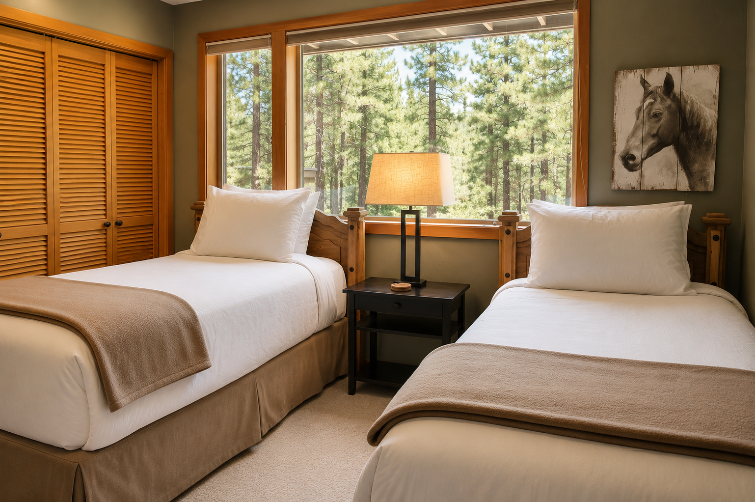 Rest peacefully in your cozy twin bedroom with plush linens and a stunning forest view. Large windows frame towering pines, filling your space with natural light and serene beauty.