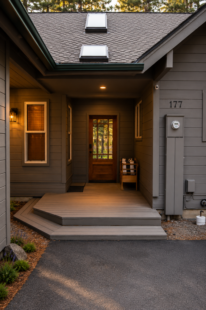 Welcome to unit 177—a cozy, modern retreat nestled among towering pines. The warm glow from the covered entrance sets the tone for your perfect getaway.