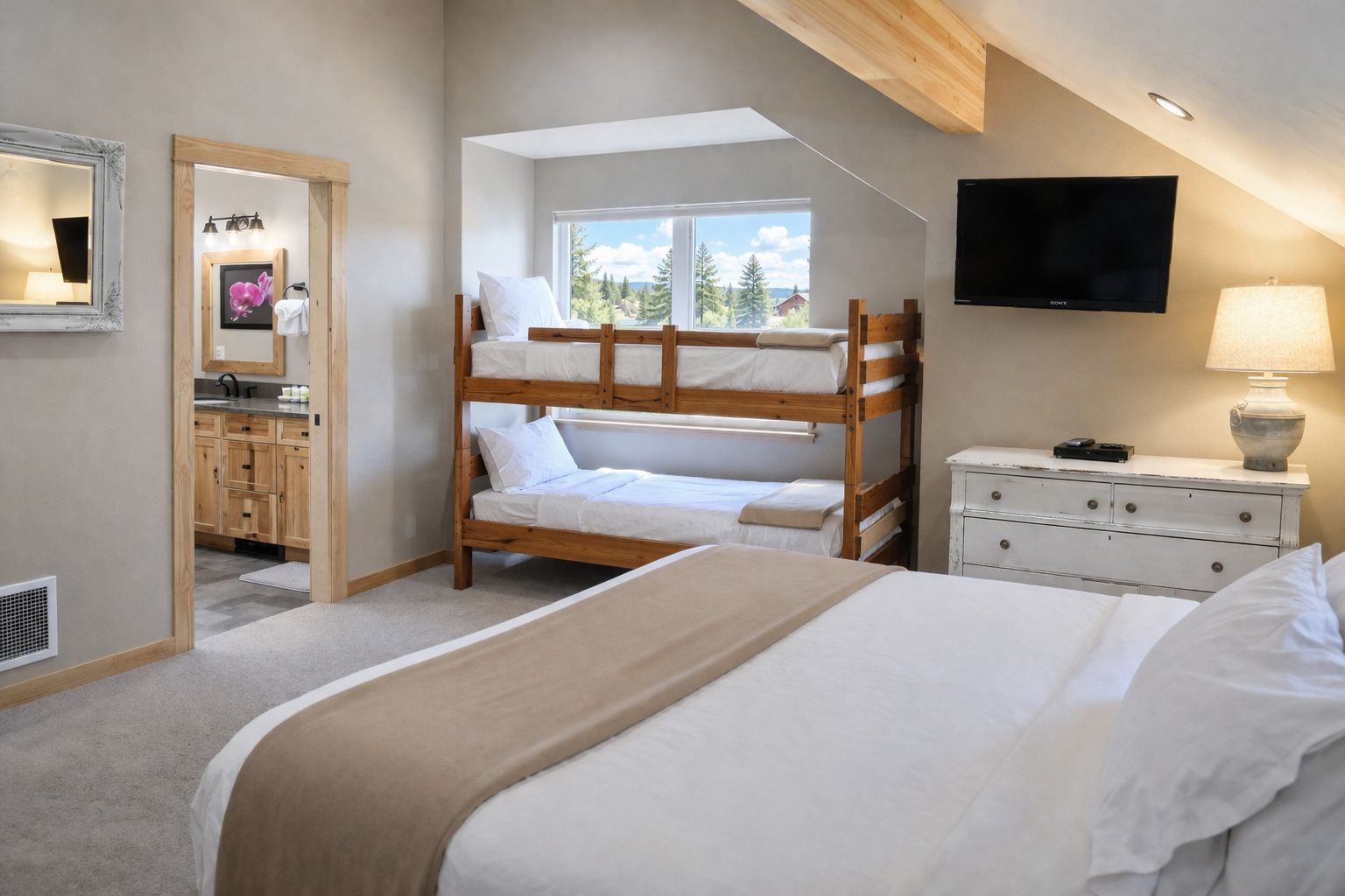 Rest peacefully in your spacious bedroom featuring a comfortable queen bed and cozy bunk beds, perfect for families seeking mountain getaway comfort.