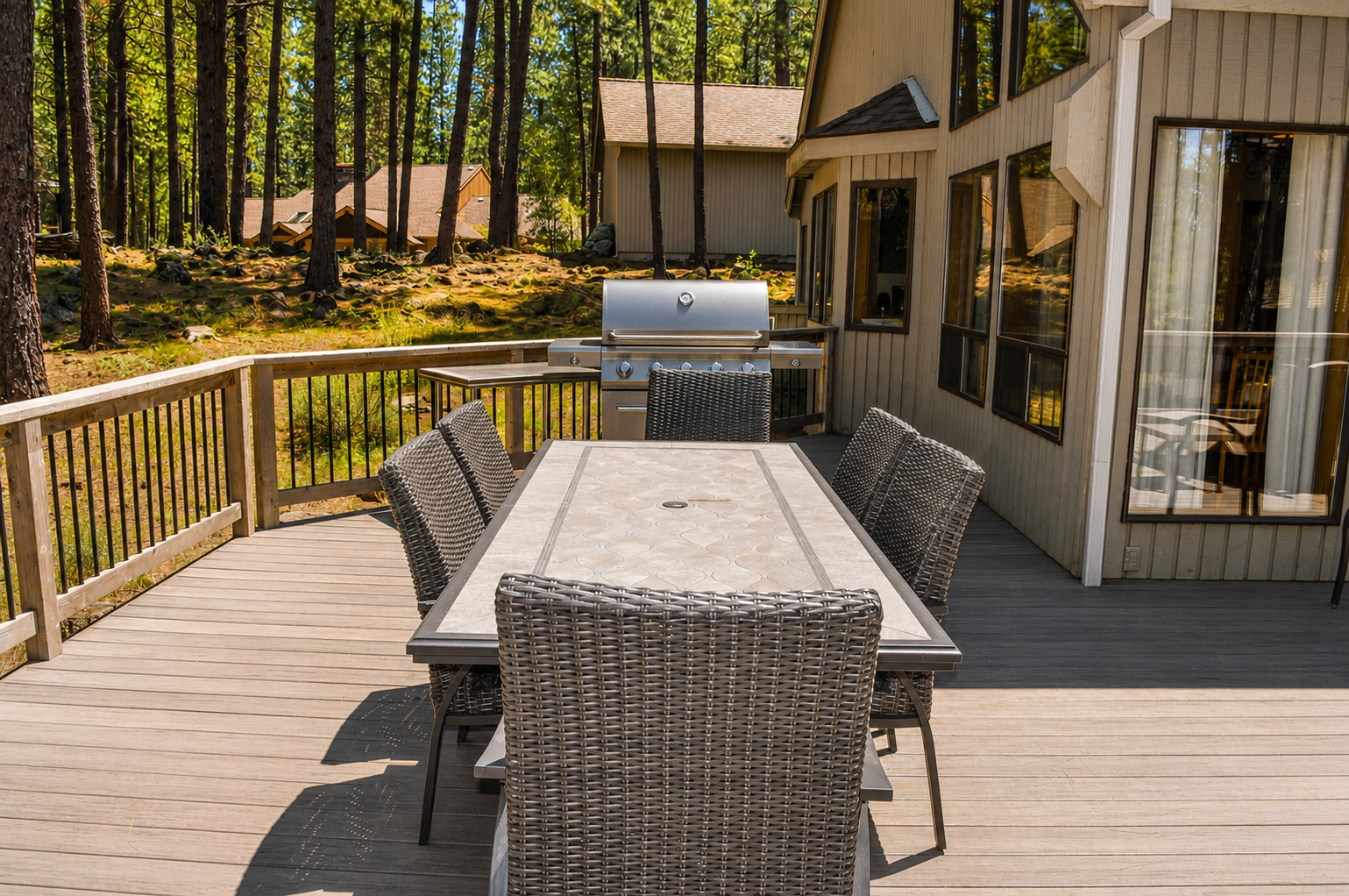 Picture yourself dining al fresco at this spacious table, grilling your favorite meals while surrounded by towering pines and forest serenity. Your perfect outdoor retreat awaits.