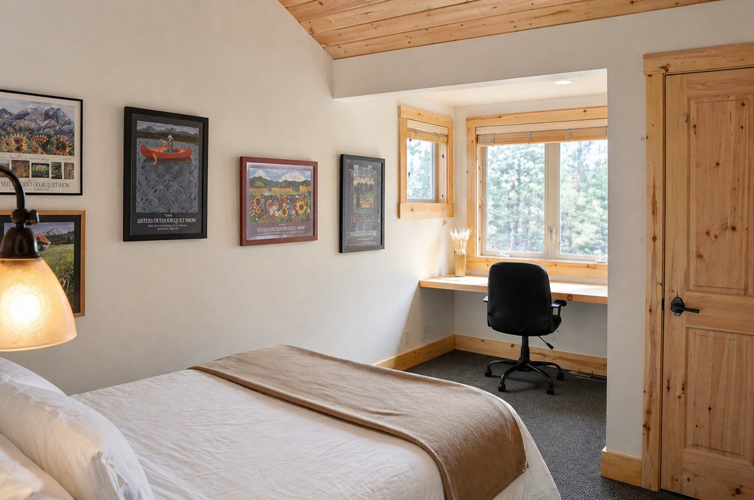 Settle into your cozy bedroom with warm wood accents, peaceful forest views, and a dedicated workspace for remote work or quiet moments.