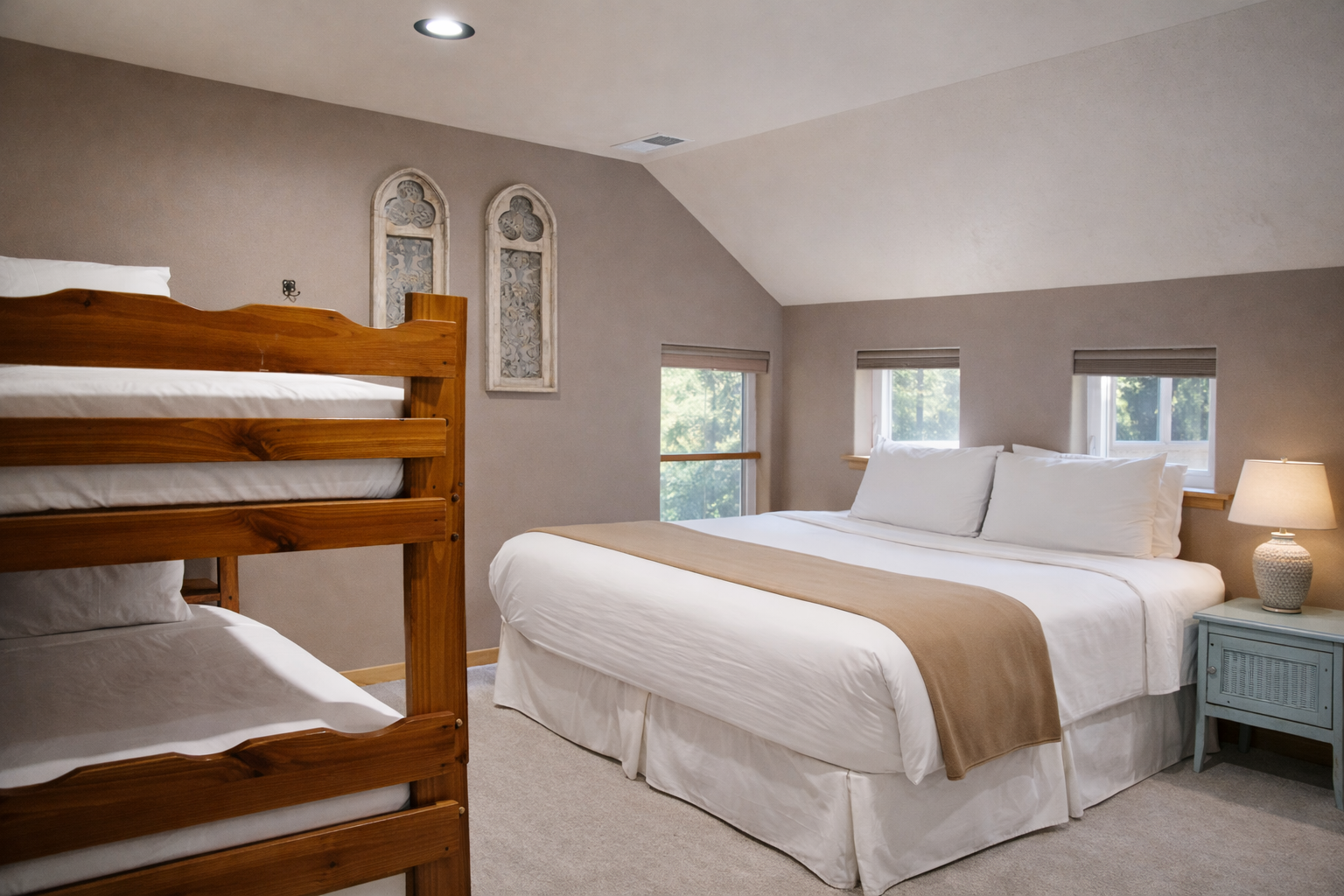 Unwind in your cozy bedroom featuring a plush king bed and sturdy bunk beds, perfect for families seeking comfort together.