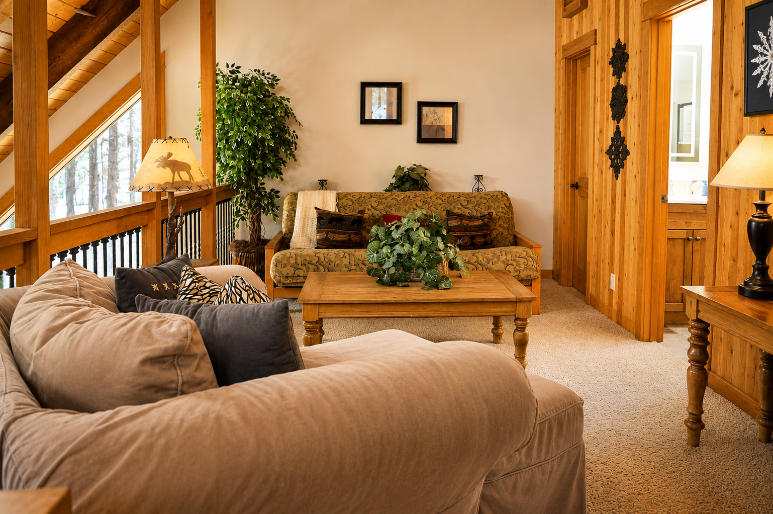 Sink into plush seating in this inviting living room, where rustic wood beams and warm touches create your perfect mountain retreat.