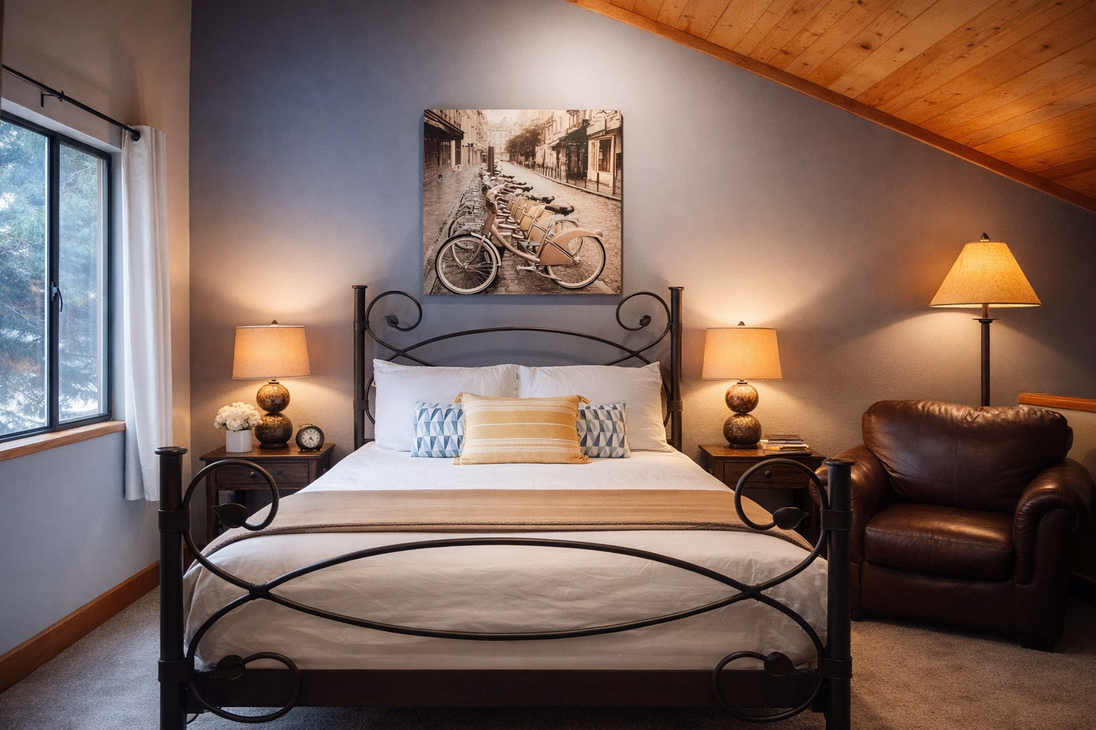 Unwind in your cozy attic retreat with warm lighting, comfortable seating, and peaceful views through the window.