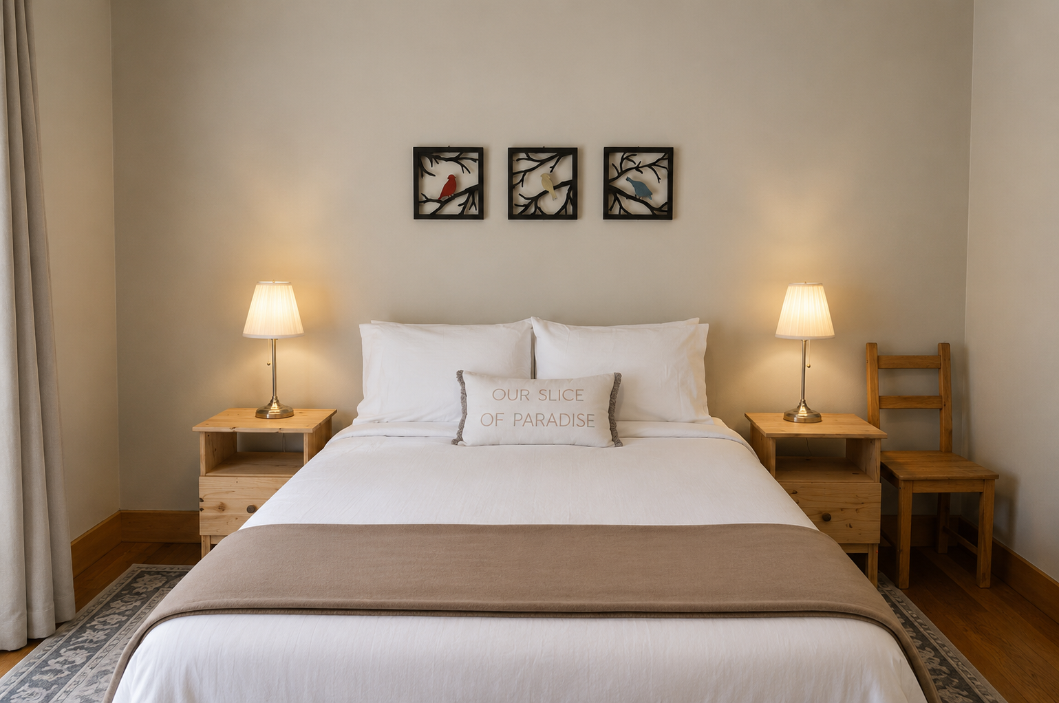 Sink into plush white bedding and let the soft glow of bedside lamps ease you into your private retreat, where simple elegance awaits.