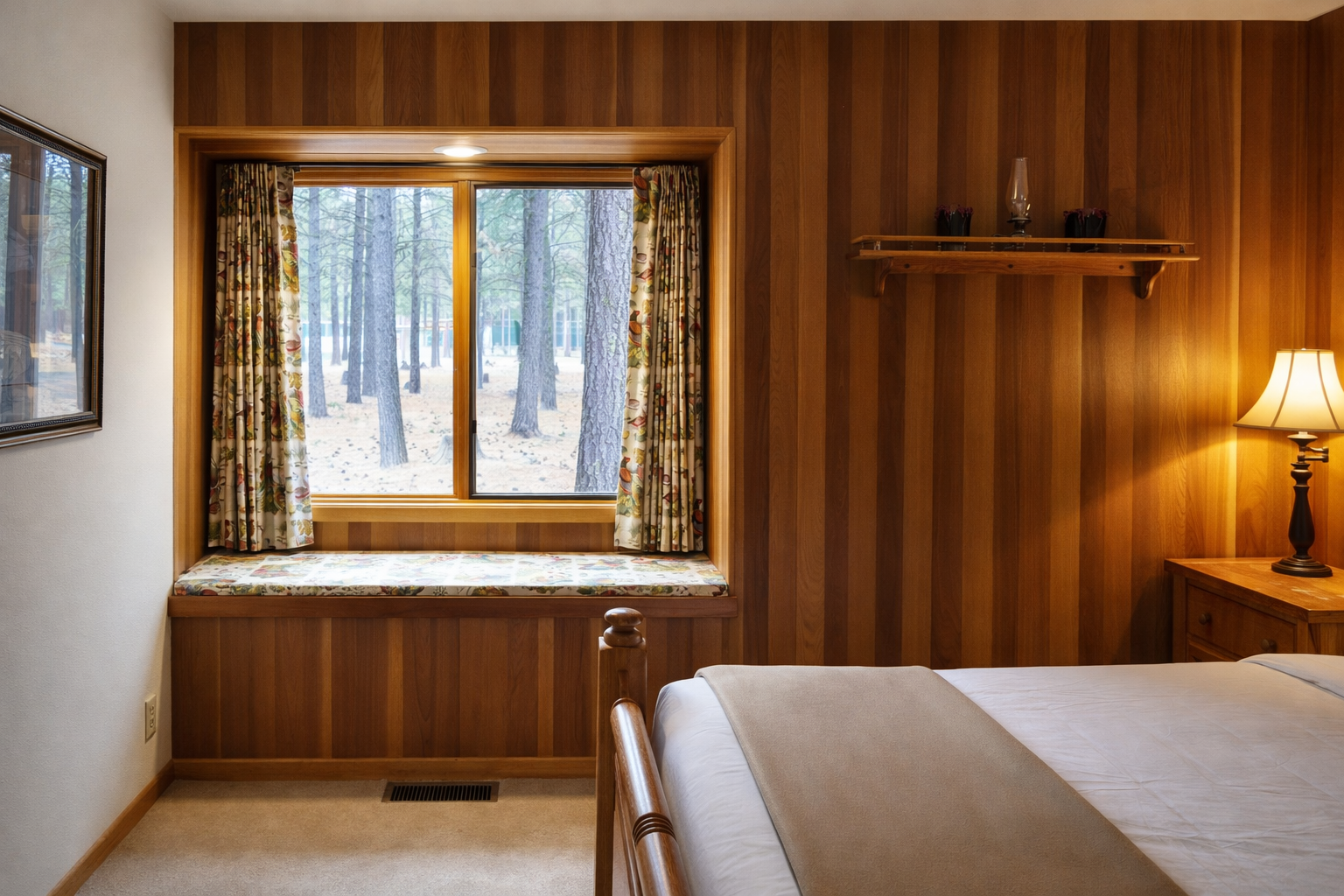 Drift off to sleep surrounded by rich wood paneling while enjoying peaceful forest views through your bedroom window.