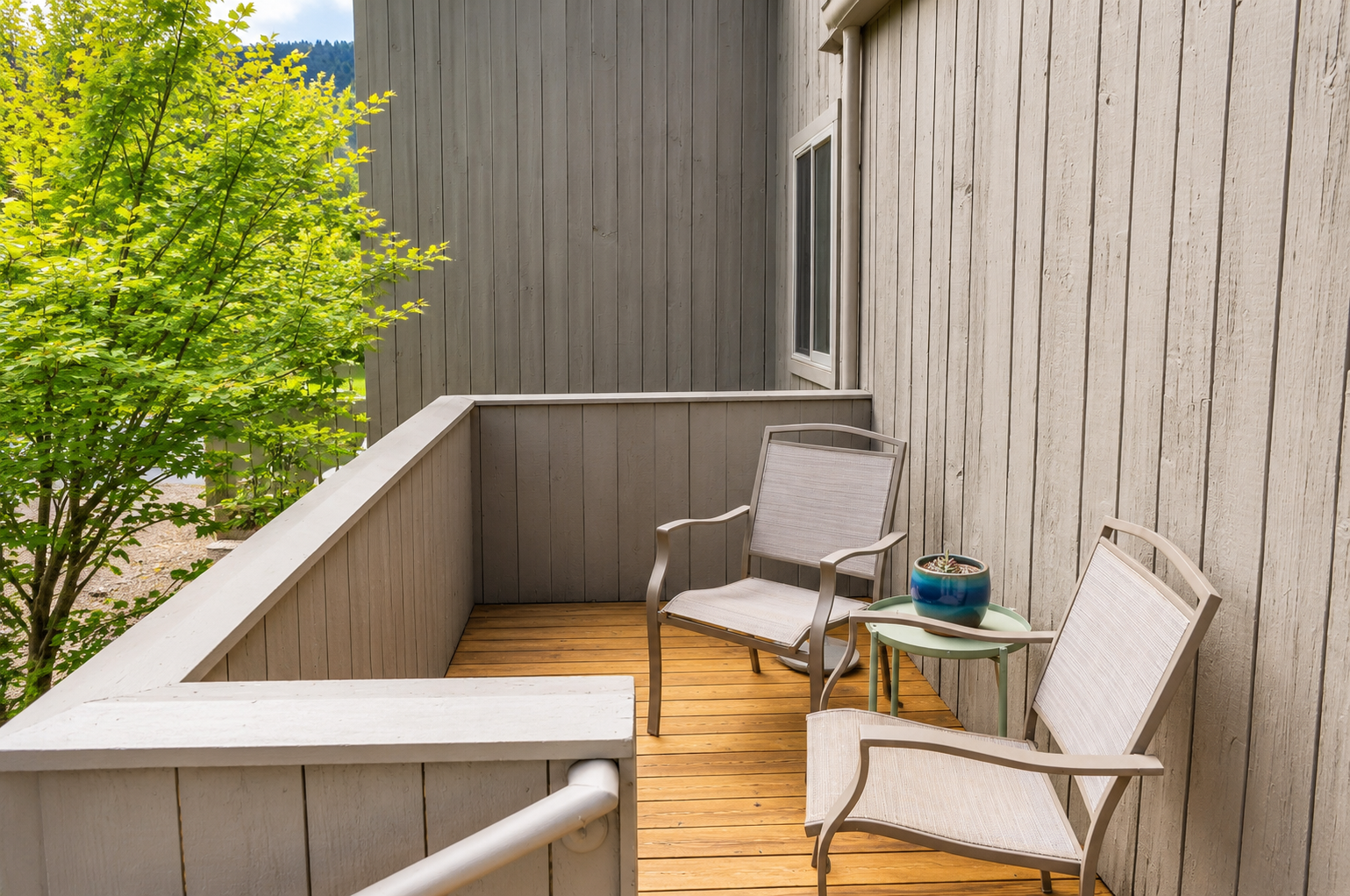 Unwind on your private balcony with morning coffee, fresh air, and peaceful tree-lined views that make every moment feel like a true escape.