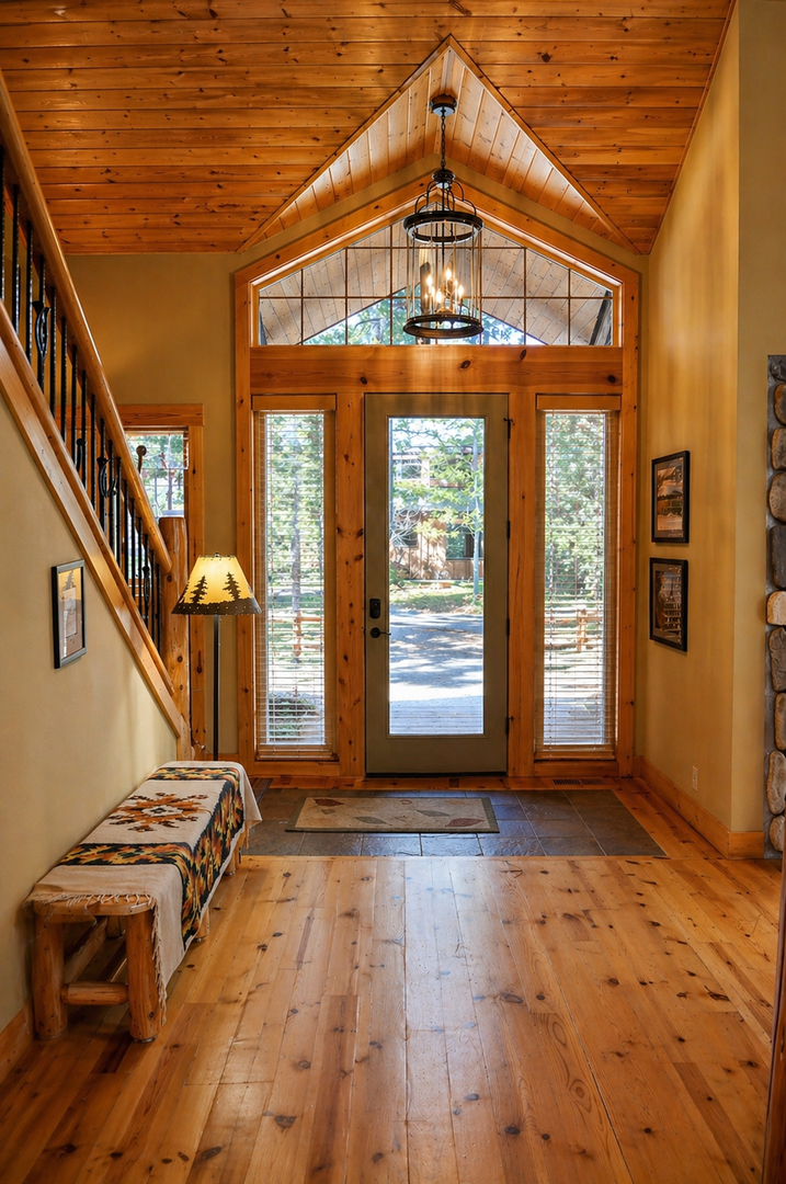 Step into your warm mountain retreat where rustic wood beams and cozy lighting create the perfect welcoming atmosphere for your getaway.