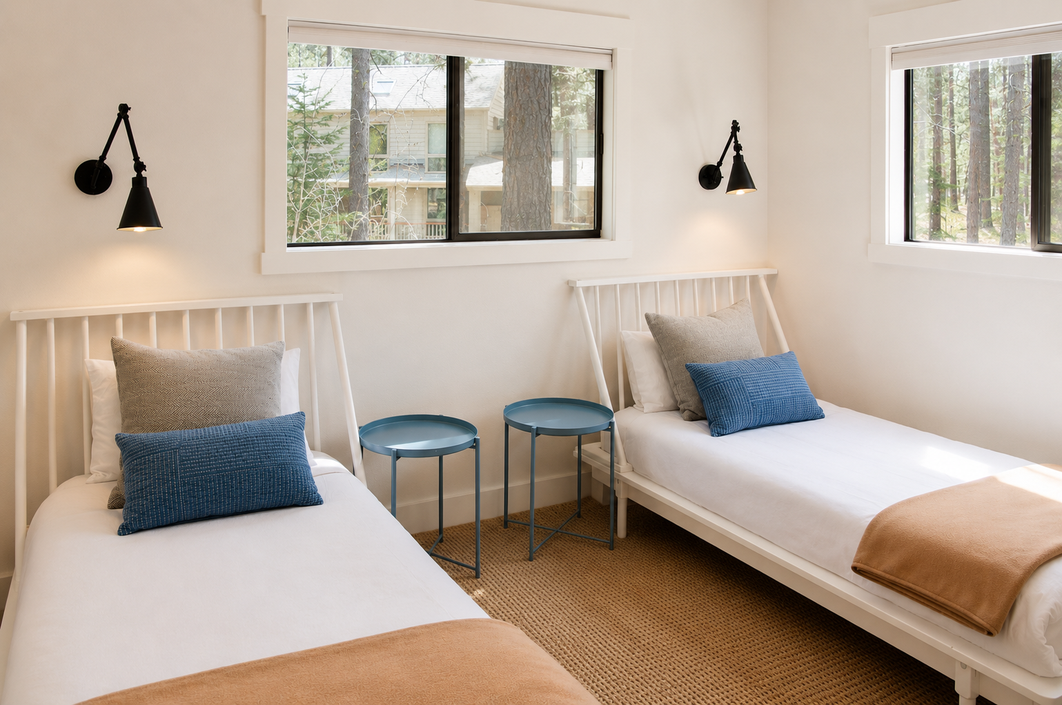 Your serene twin bedroom awaits, with crisp linens, stylish bedside tables, and forest views that invite restful mornings and peaceful nights.