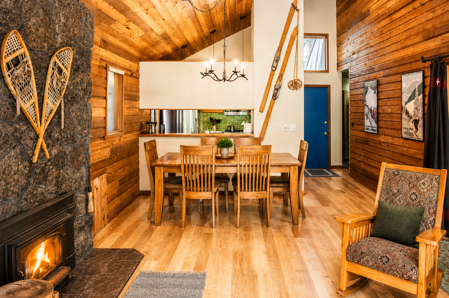 Picture yourself relaxing by the fireplace in this rustic mountain retreat with warm wood finishes, charming vintage ski decor, and an inviting open layout perfect for your mountain getaway.