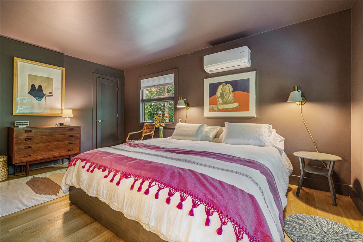 Drift off in your dreamy bedroom with plush bedding, curated art, and perfect climate control for restful nights.