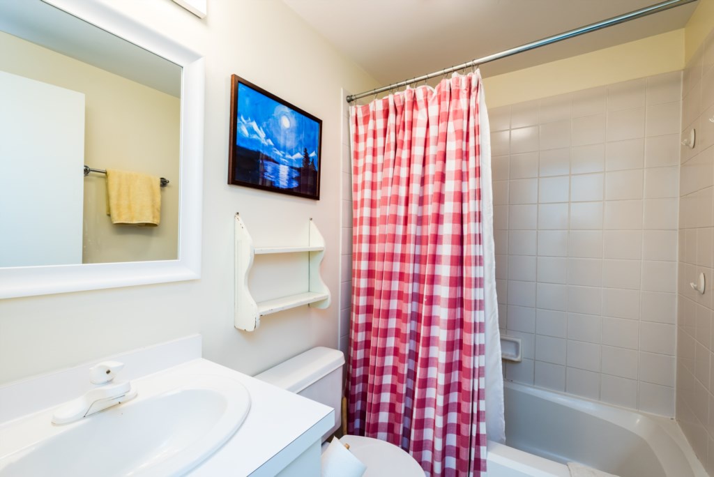 Full guest bathroom upstairs, shared by two bedrooms.