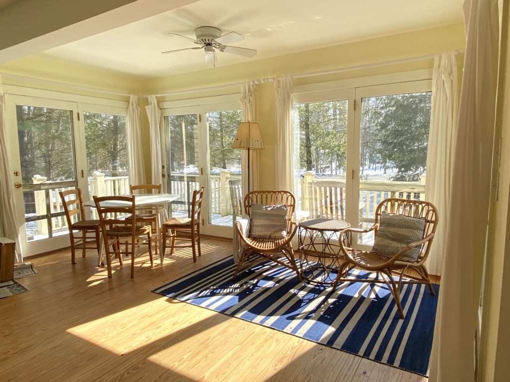 Sunny front table with game table and seating area.