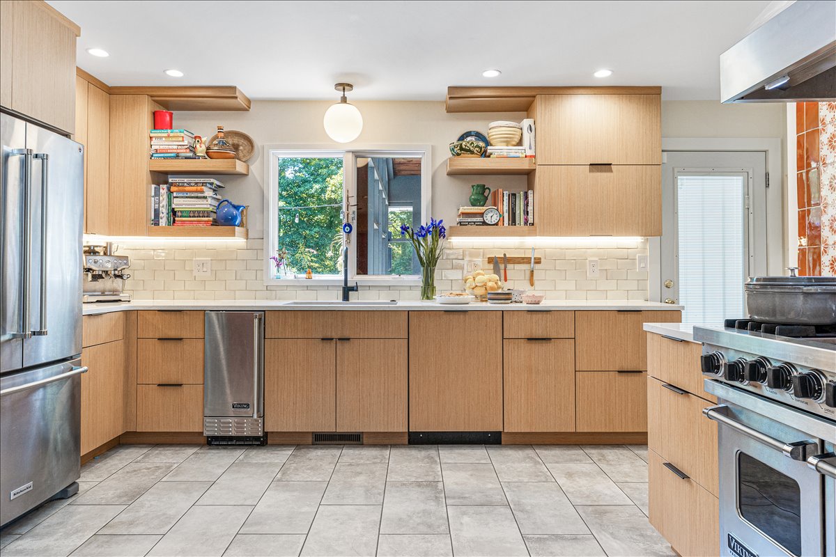 Cook up your favorite meals in this spacious, well-appointed kitchen with modern appliances and beautiful natural light streaming through the window.