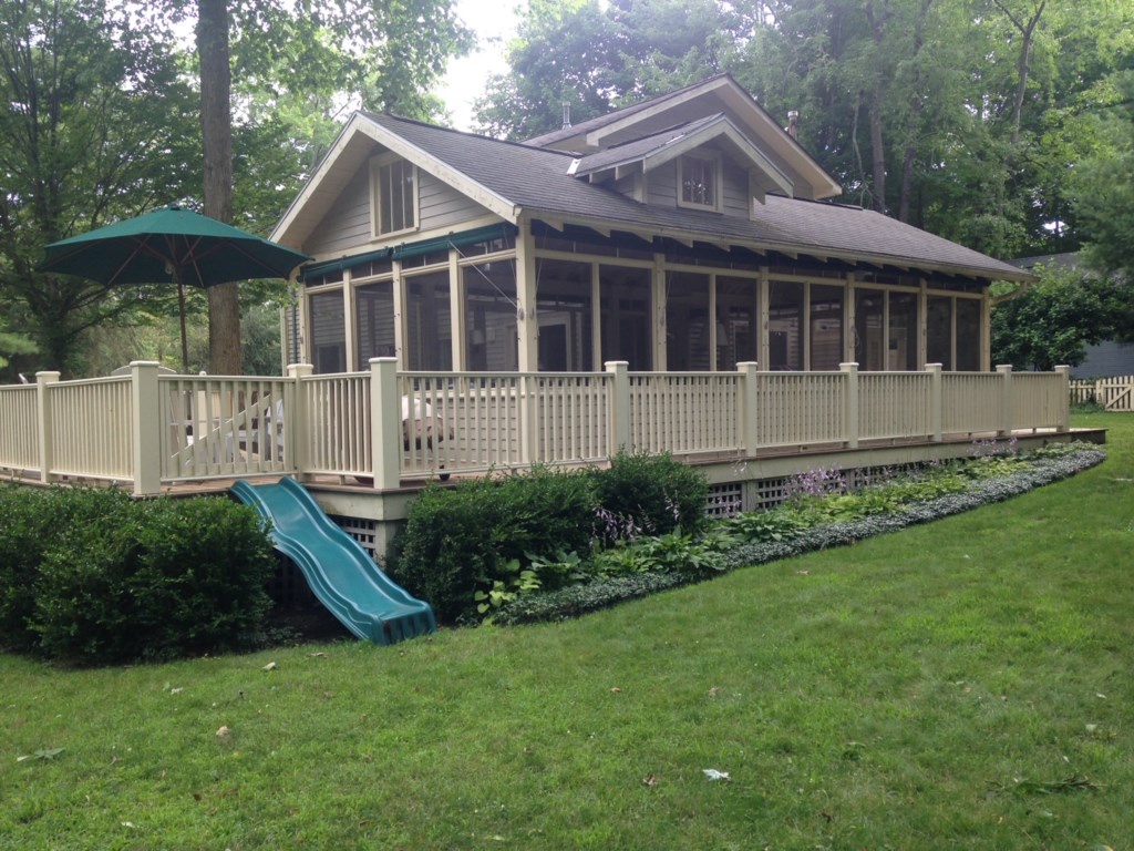 Extra large screened porch and deck overlooking the pool.