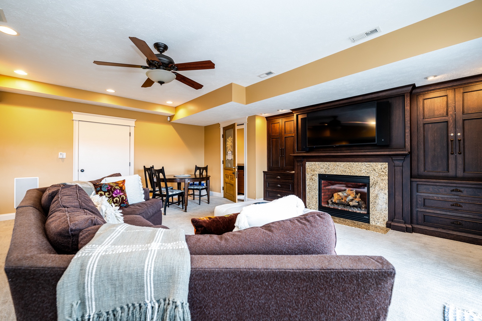 Walkout Basement TV Room w. Fireplace