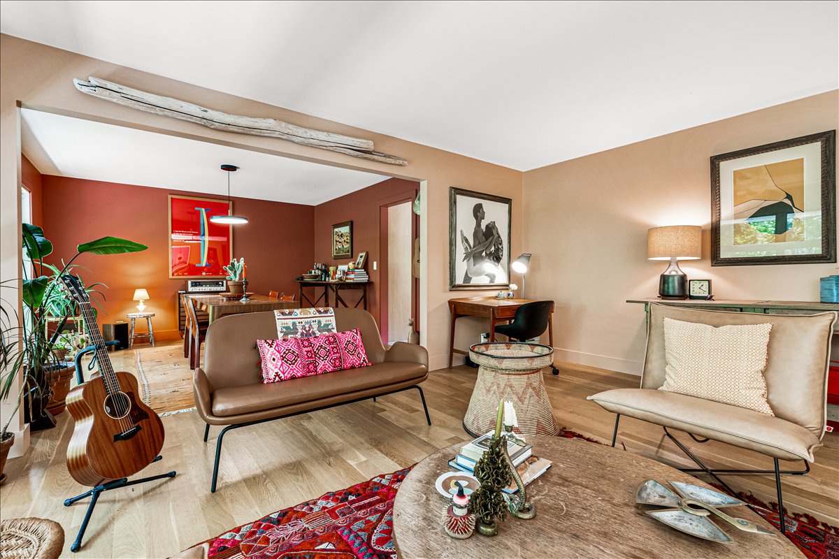 Sink into stylish leather seating surrounded by warm colors, curated artwork, and thoughtful touches that make this your creative retreat.