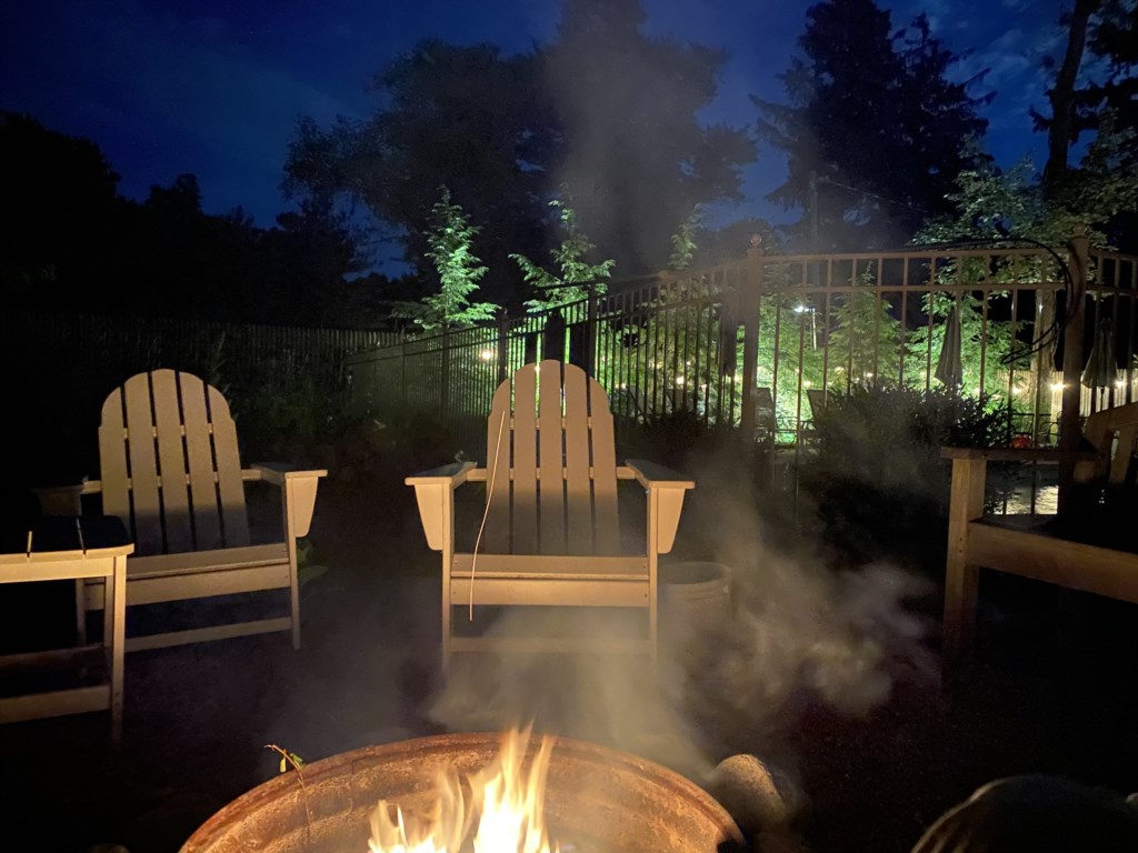 Firepit, with pool and hot tub behind.