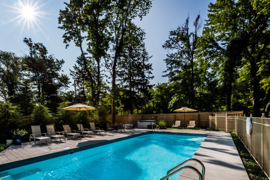 View from deep end of pool, with hot tub (new in 2020) in the far corner.