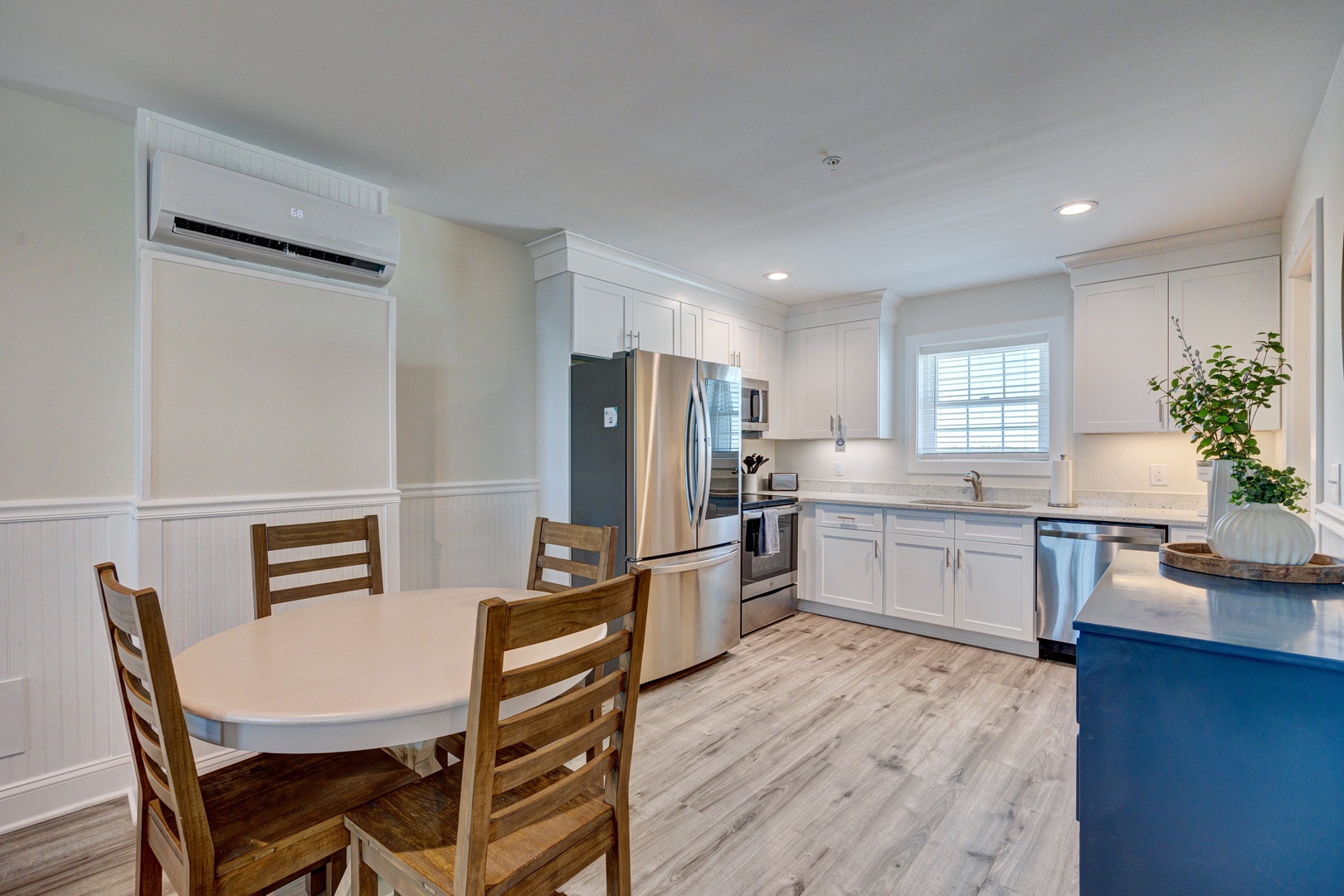 Your fully equipped kitchen awaits with modern appliances and dining space where you can prepare home-cooked meals together.