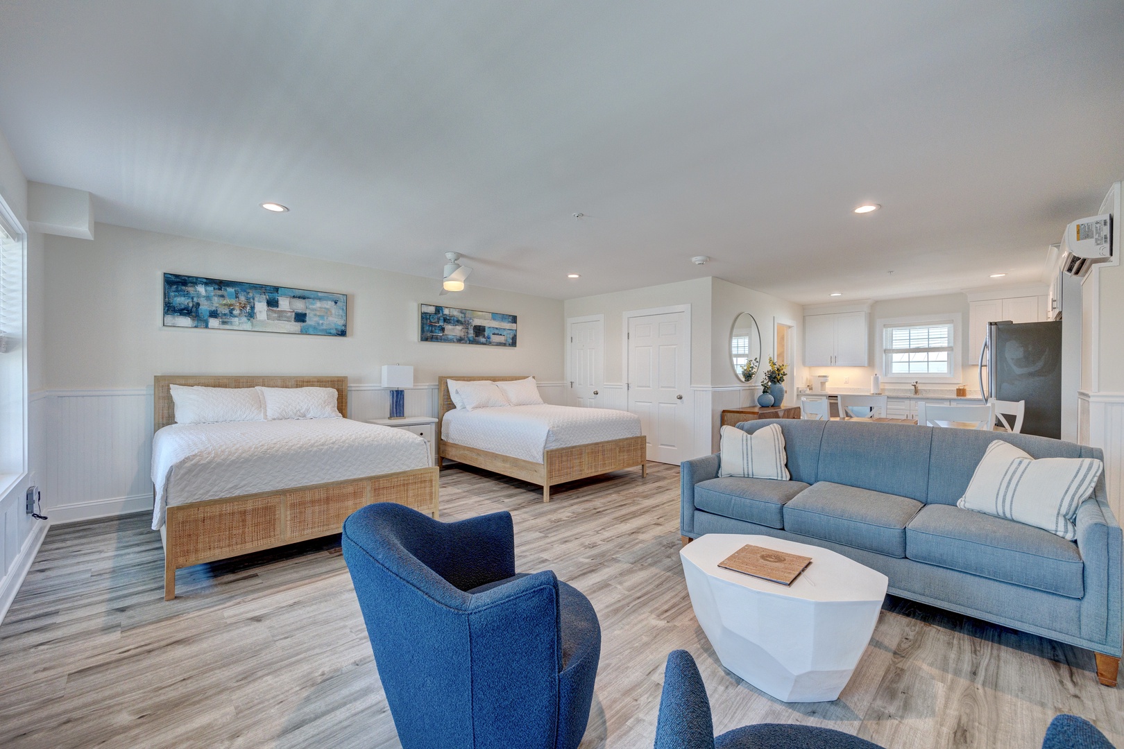 Unwind in your spacious suite where two comfortable beds and a cozy seating area create the perfect retreat for relaxation.