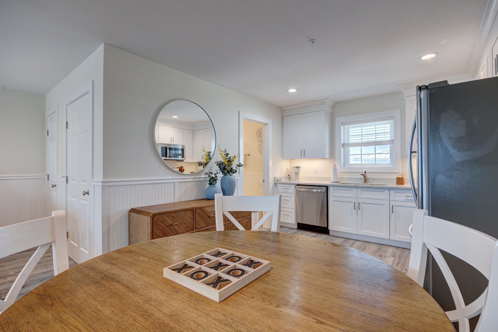 Your bright dining area flows into a fully equipped kitchen, perfect for sharing meals with loved ones in comfort.