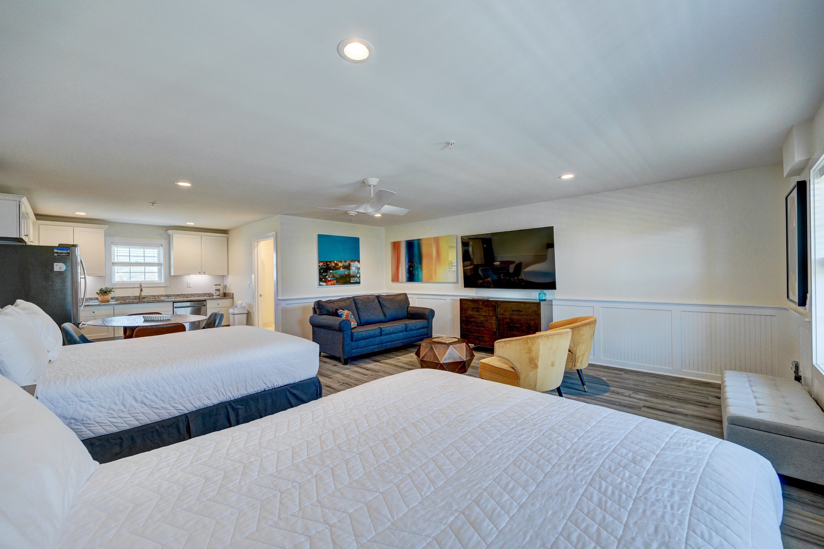 Relax in your spacious suite with two plush beds, modern kitchen, and stylish living area perfect for unwinding after your adventures.