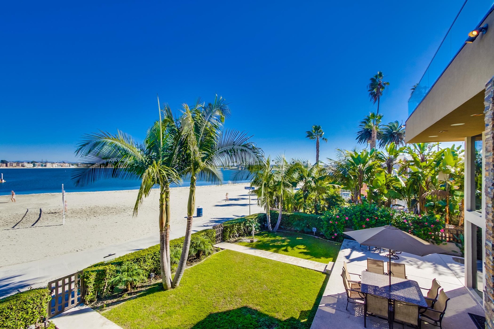 Grass yard and sandy beach