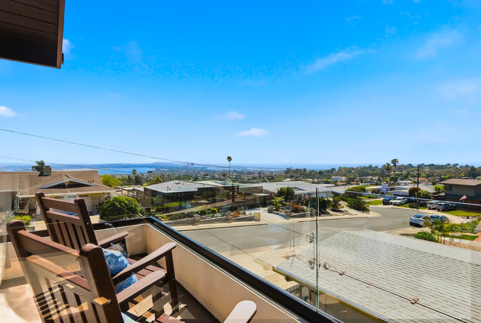 Sip morning coffee from your private balcony while taking in sweeping coastal views and neighborhood charm below.