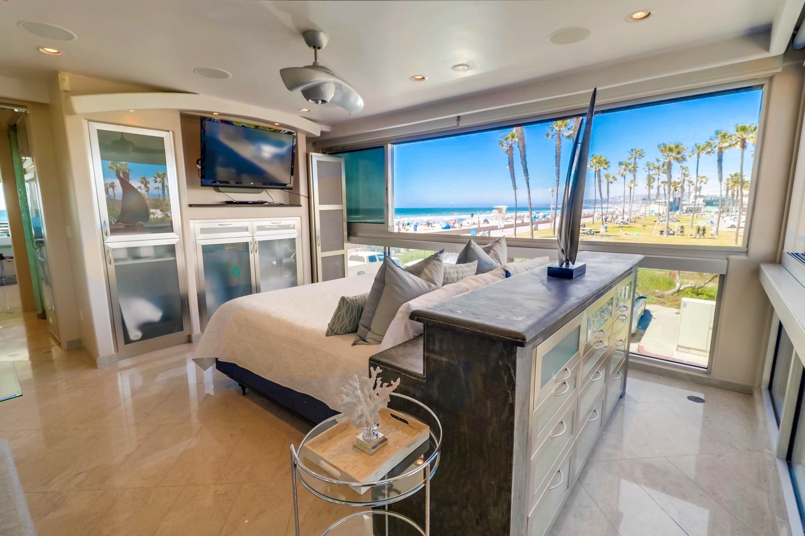 Features ceiling fan and flat screen TV