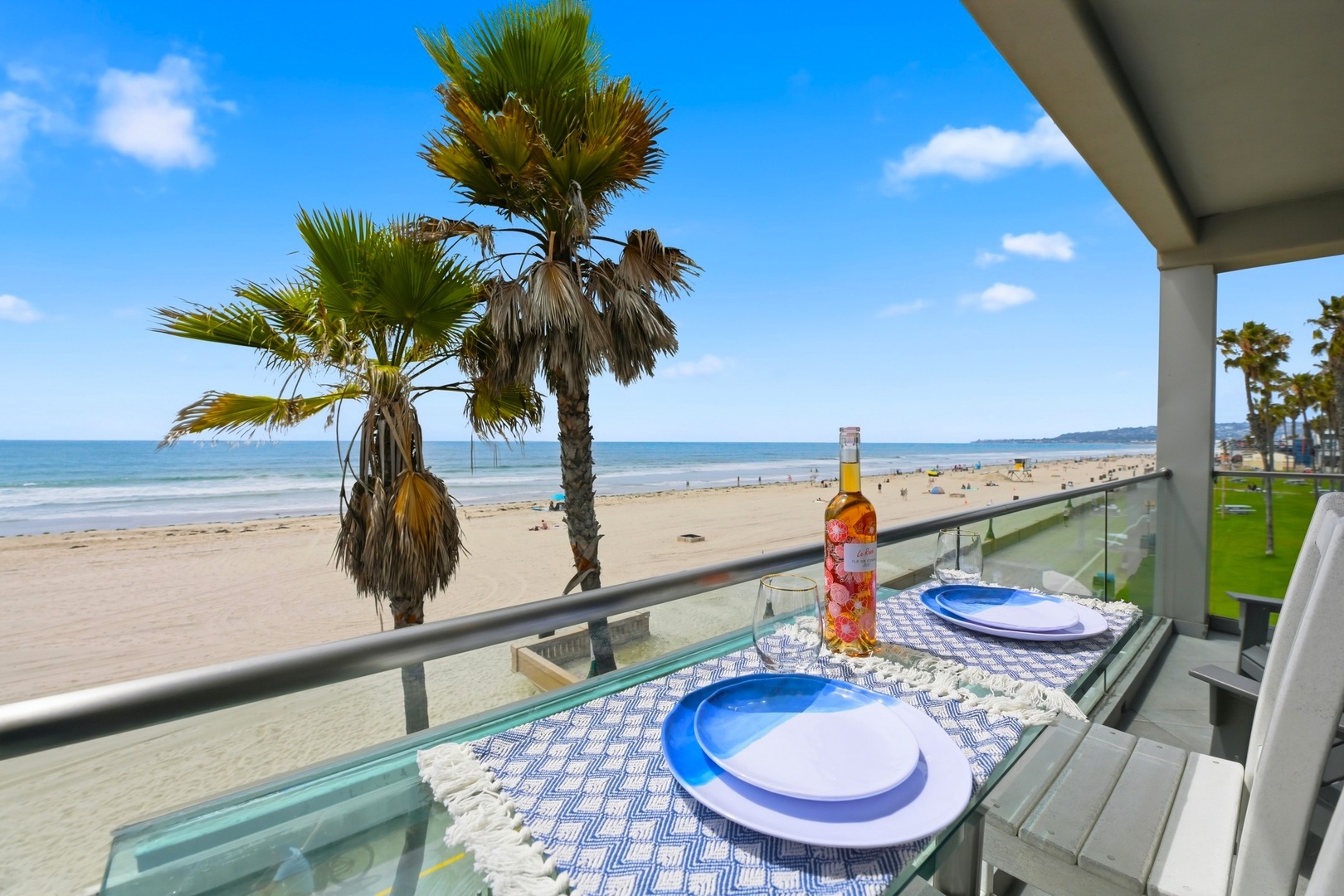 Beachfront balcony with palm trees