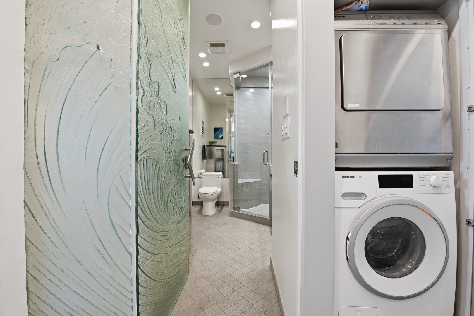 Hall bathroom and stack laundry