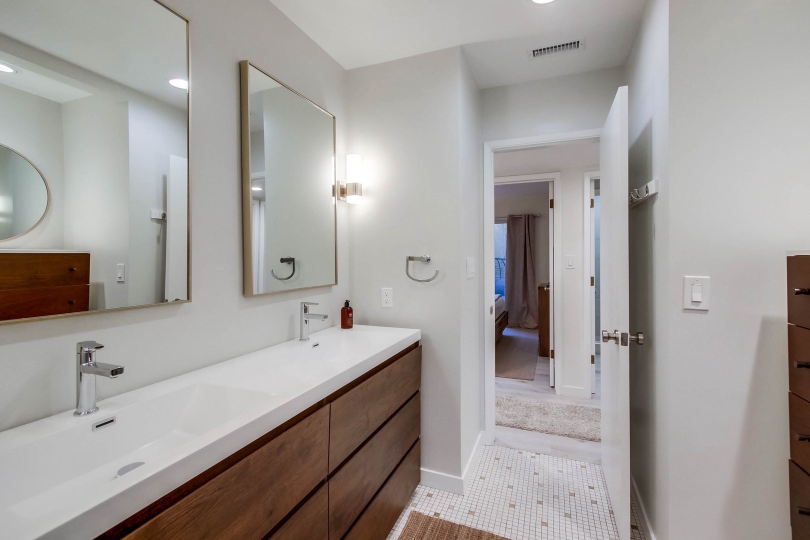 Hall bathroom with dual sink vanity
