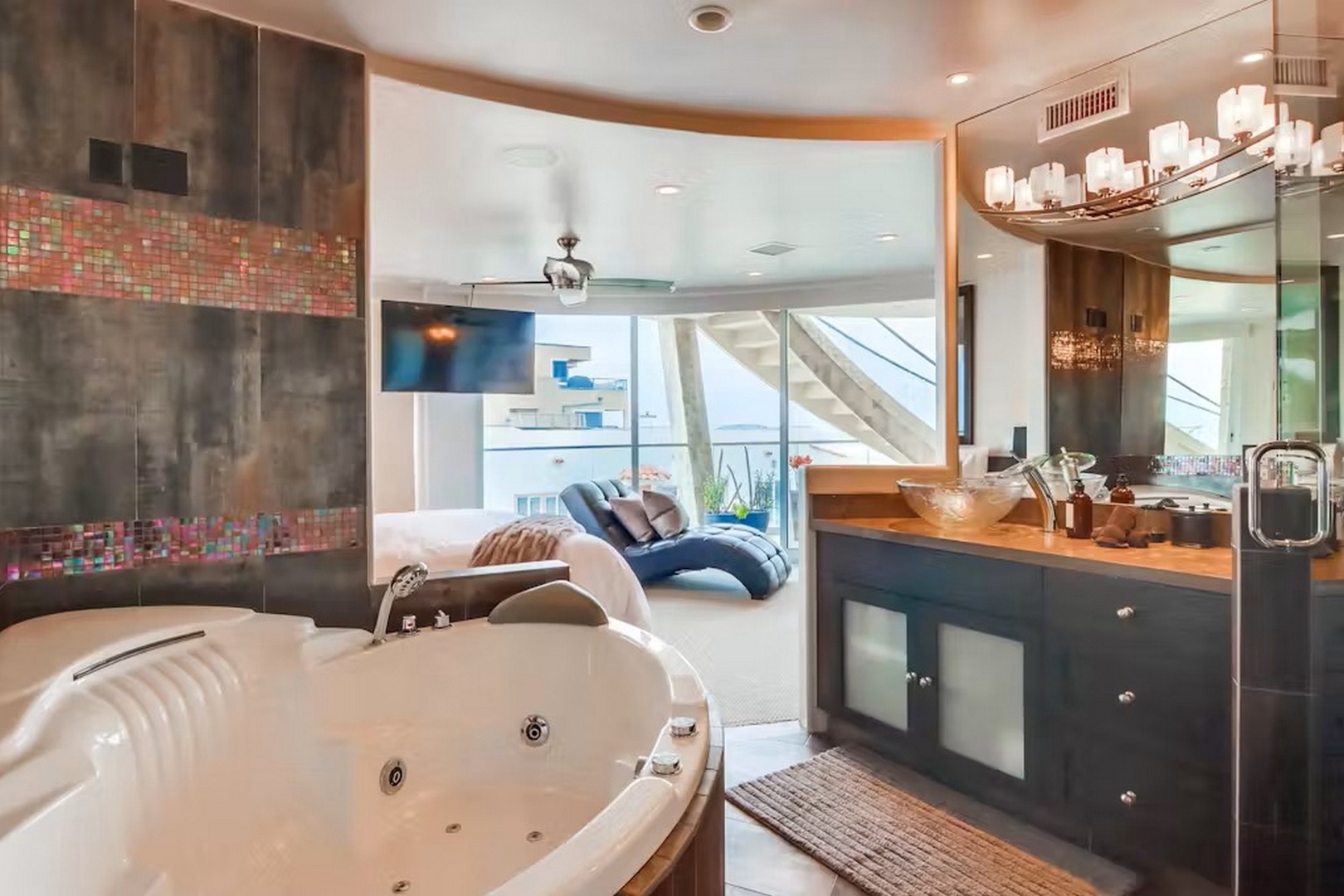 Unwind in your private spa-like bathroom with a deep soaking tub, premium fixtures, and a flowing design that seamlessly connects your relaxation space to the rest of your suite.