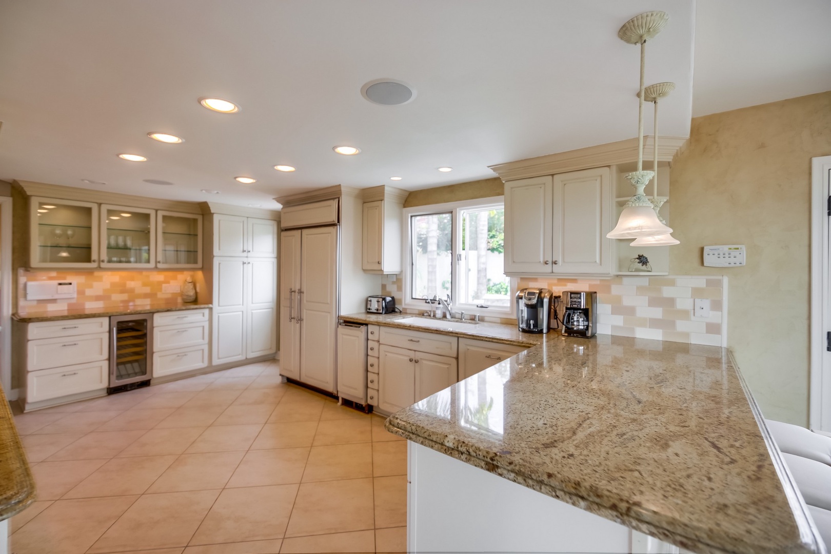 Spacious kitchen with stone counters