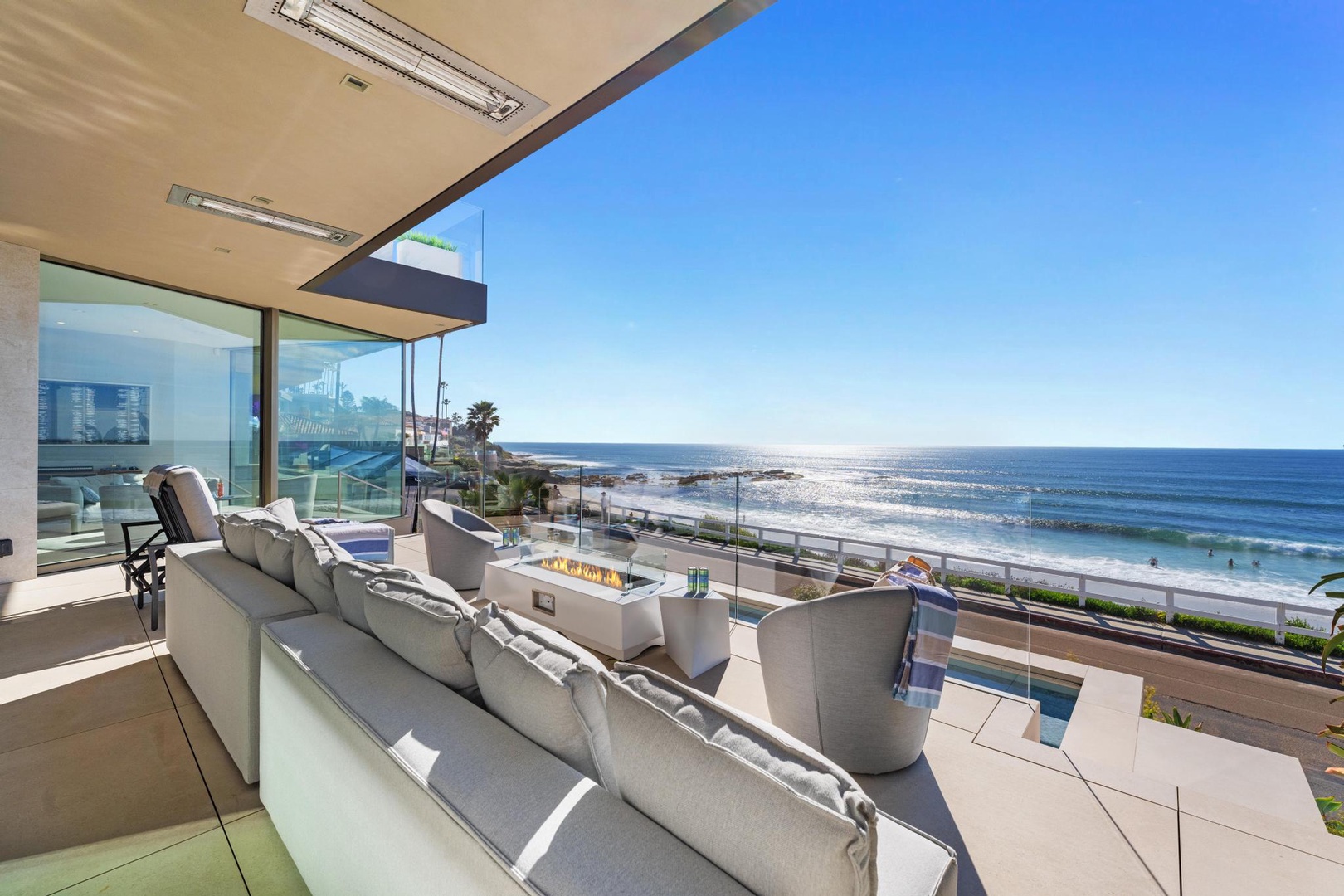 Oceanfront pool deck with fire pit