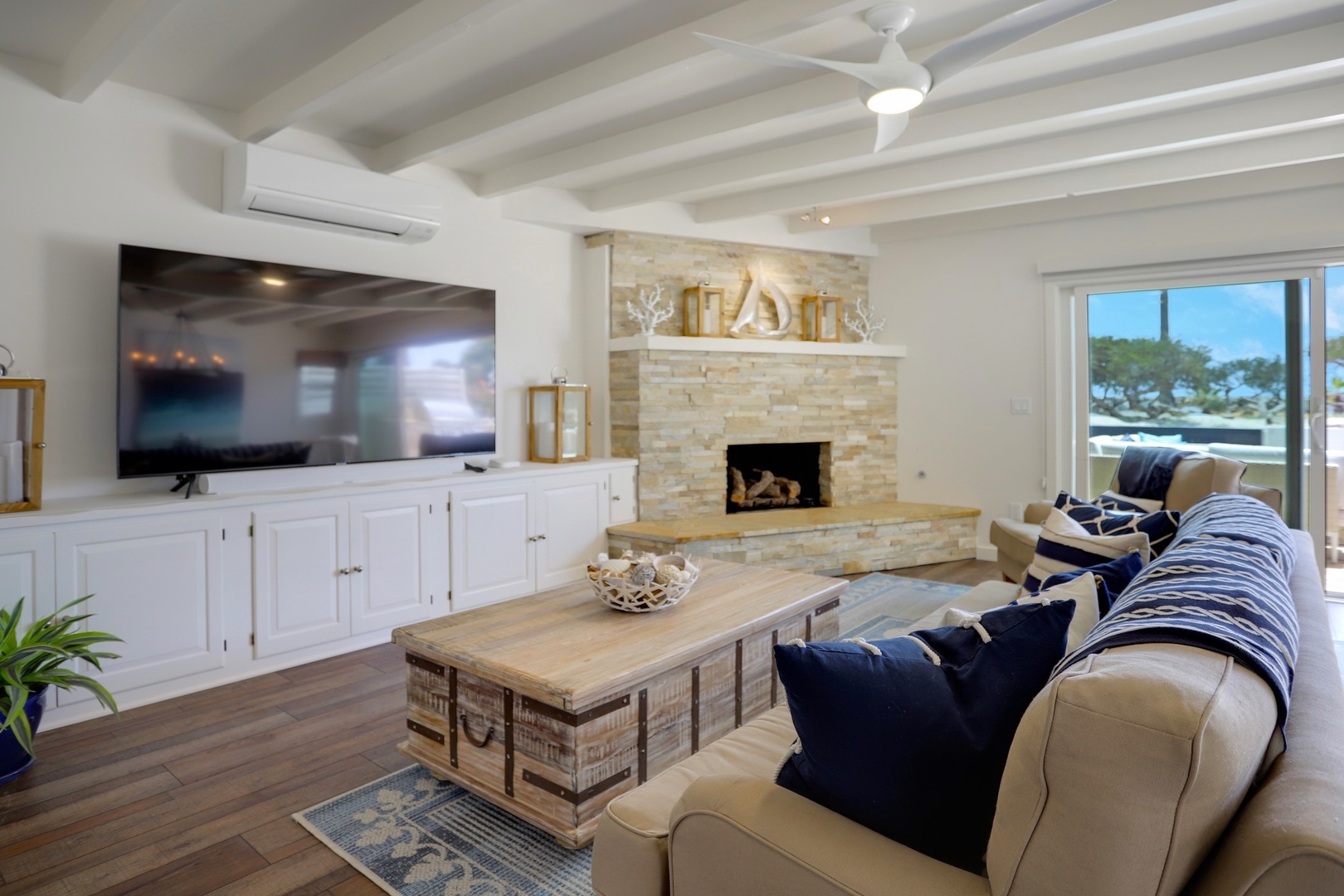 Living room with stacked stone fireplace