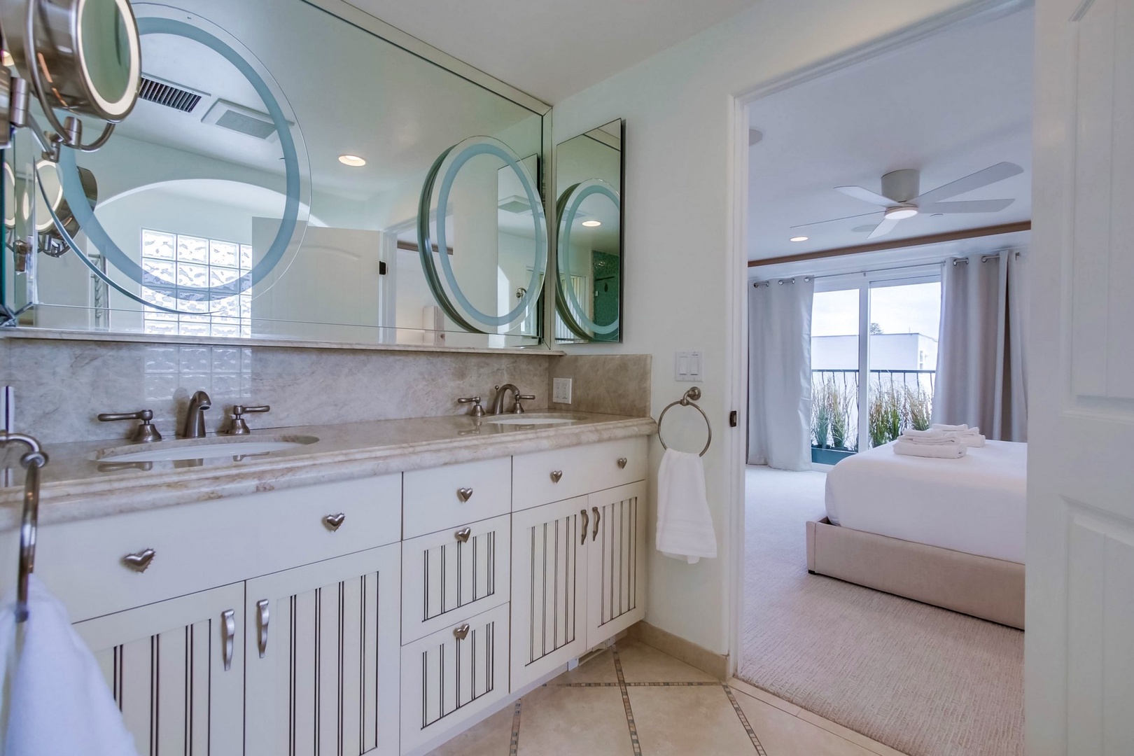 Primary Suite bathroom with dual vanities