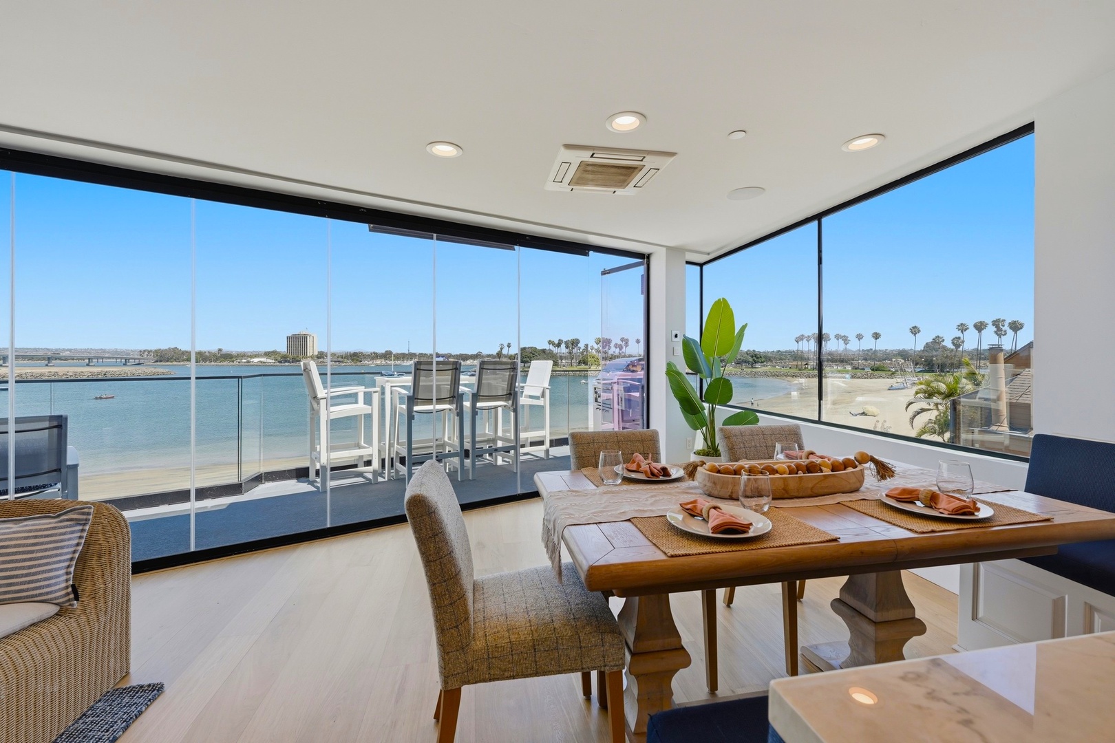 Bright dining area with floor-to-ceiling windows