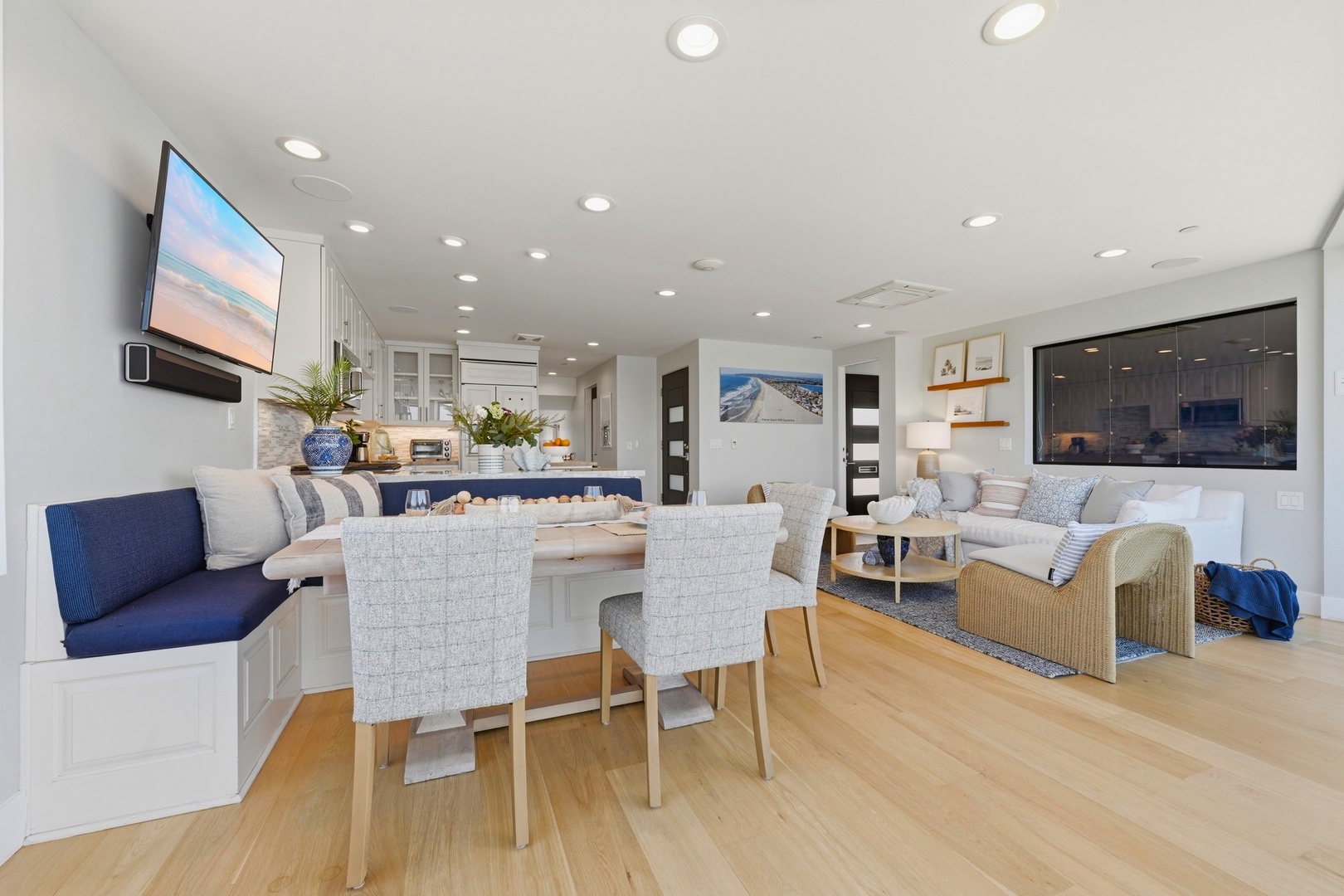 Step into this bright, open-concept space where your dining, kitchen, and living areas flow together beautifully. Imagine morning coffee at the breakfast bar or cozy evenings on the sofa.