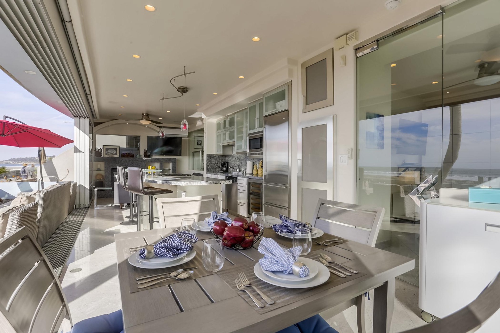 Dining table looks out over kitchen