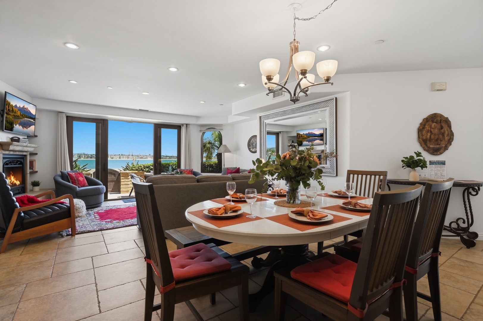 Gather around this elegant dining table while bay views frame your meals through floor-to-ceiling windows.