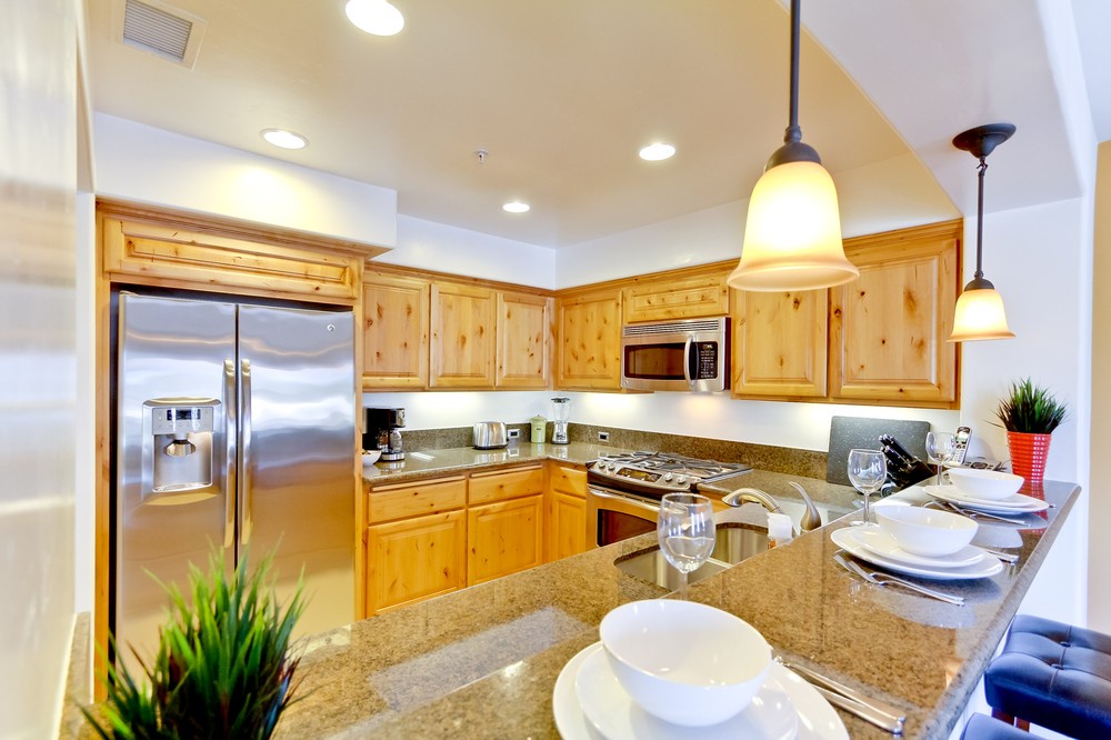 Open kitchen with granite and stainless appliances