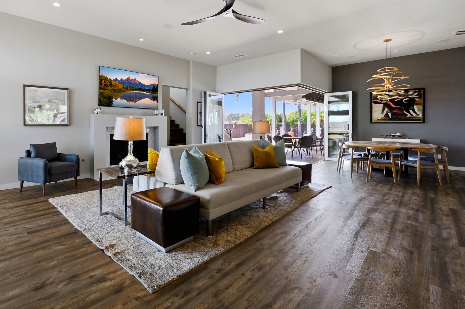 Relax in your stylish open-plan living space with designer touches and vibrant accent colors creating a warm, welcoming atmosphere.